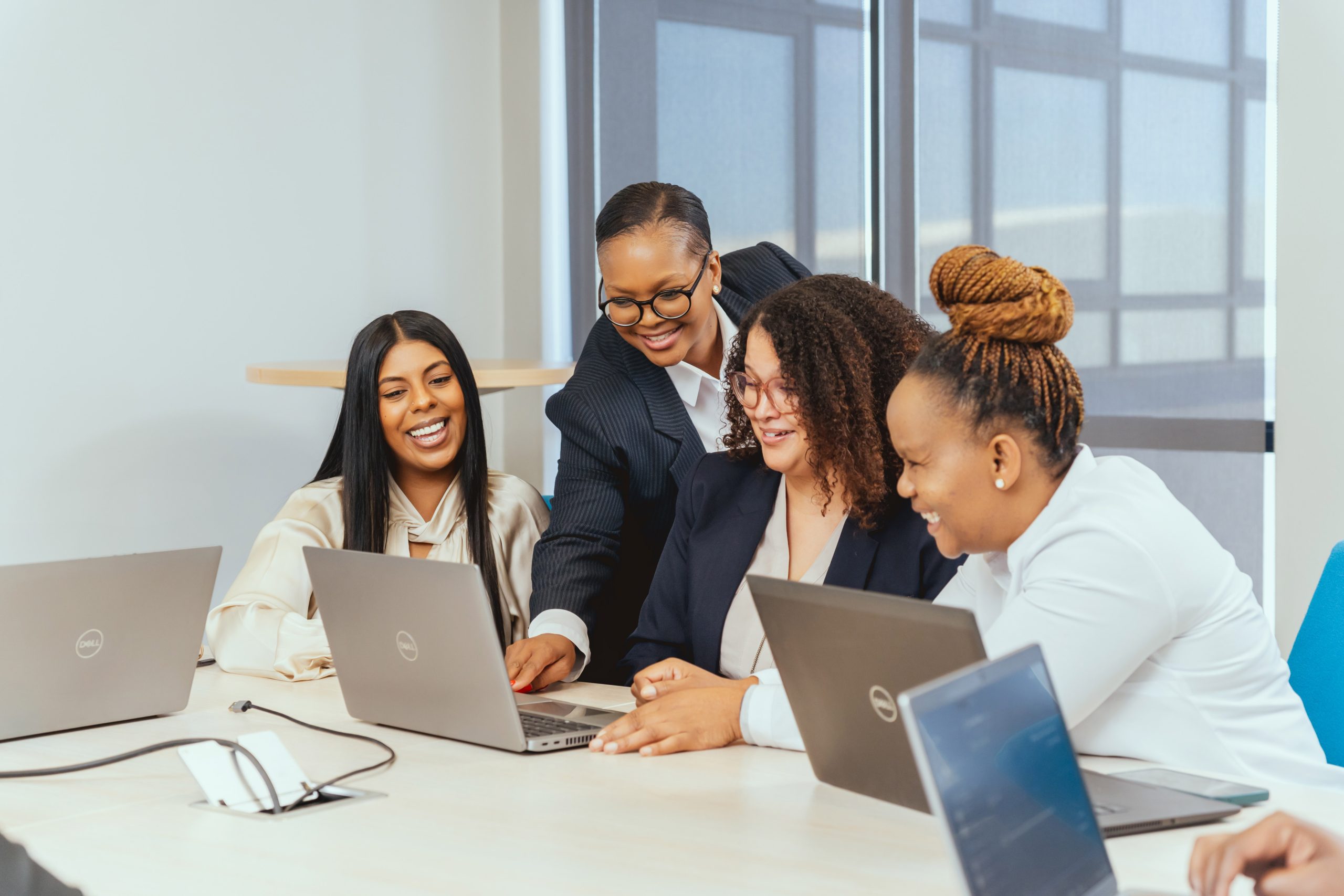 Team working together around a laptop