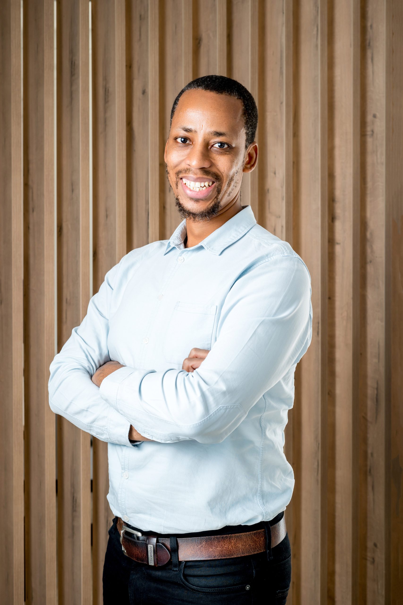 Corporate portrait of a man in a light shirt