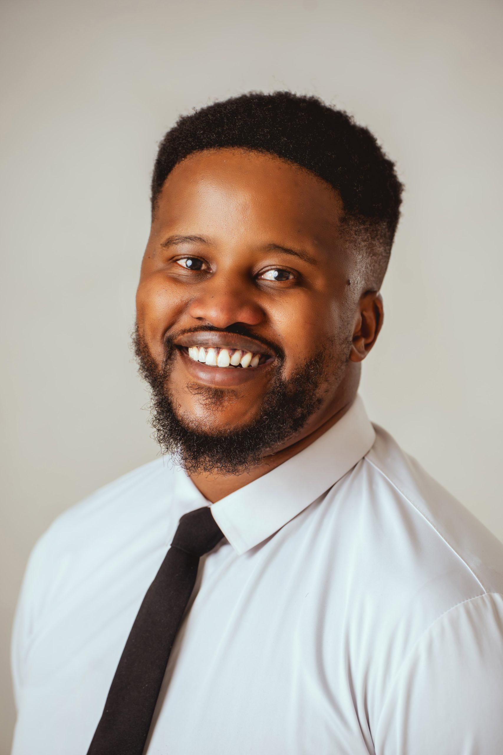 Smiling corporate headshot of a man